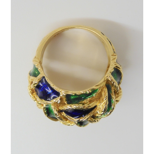 2799 - AN ENAMELLED KUTCHINSKY RINGthe woven pattern enamelled in blue and green, Full Kutchinsky signature... 