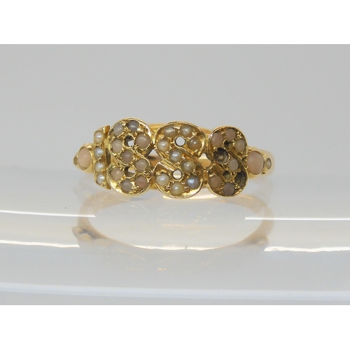 2800 - A VICTORIAN RINGthe date 1888 picked out in split pearls and corals to the yellow metal mount. Finge... 