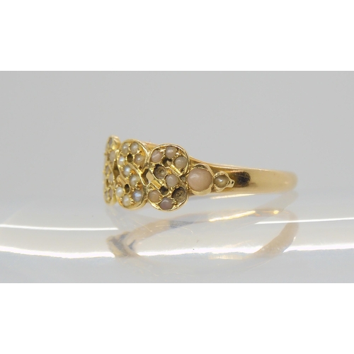 2800 - A VICTORIAN RINGthe date 1888 picked out in split pearls and corals to the yellow metal mount. Finge... 