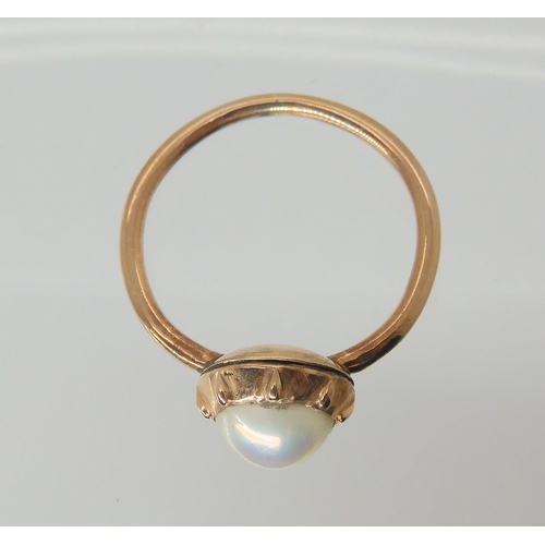 2802 - A VICTORIAN PEARL SET RINGsize of the pearl approx 6.1mm, in cut back setting. Mounted in rose colou... 