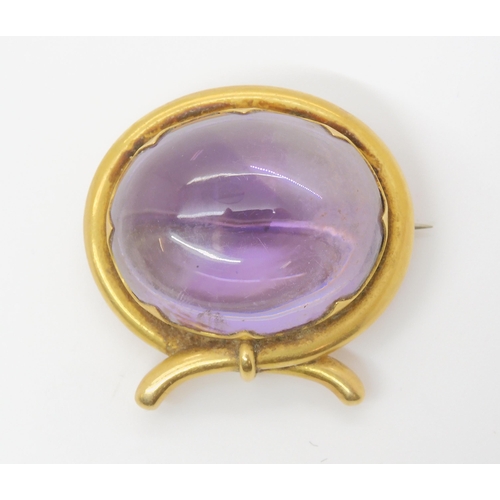 2804 - A LARGE AMETHYST BROOCHmounted in yellow metal mount. size of the amethyst 3cm x 2.5cm, size of moun... 