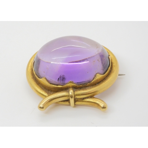 2804 - A LARGE AMETHYST BROOCHmounted in yellow metal mount. size of the amethyst 3cm x 2.5cm, size of moun... 