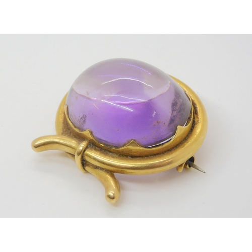 2804 - A LARGE AMETHYST BROOCHmounted in yellow metal mount. size of the amethyst 3cm x 2.5cm, size of moun... 