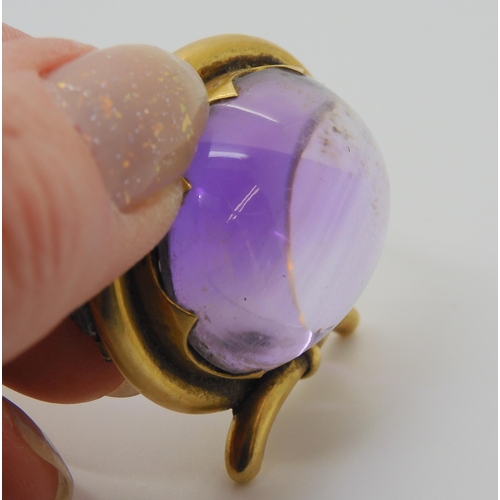 2804 - A LARGE AMETHYST BROOCHmounted in yellow metal mount. size of the amethyst 3cm x 2.5cm, size of moun... 