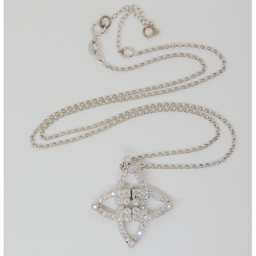 2807 - AN UNUSUAL MAGNETIC DIAMOND NECKLACEthe 18k white gold necklace can be worn in two ways as a star sh... 