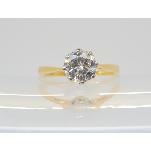 2809 - A SOLITAIRE DIAMOND RINGthe 18ct yellow and white gold classic crown mount is set with an estimated ... 