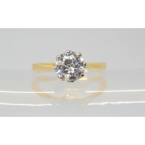 2809 - A SOLITAIRE DIAMOND RINGthe 18ct yellow and white gold classic crown mount is set with an estimated ... 