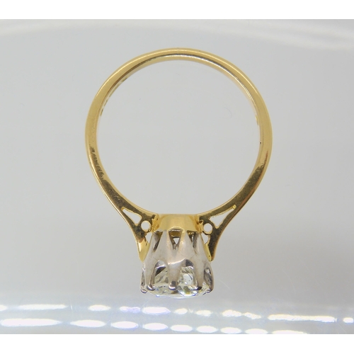 2809 - A SOLITAIRE DIAMOND RINGthe 18ct yellow and white gold classic crown mount is set with an estimated ... 