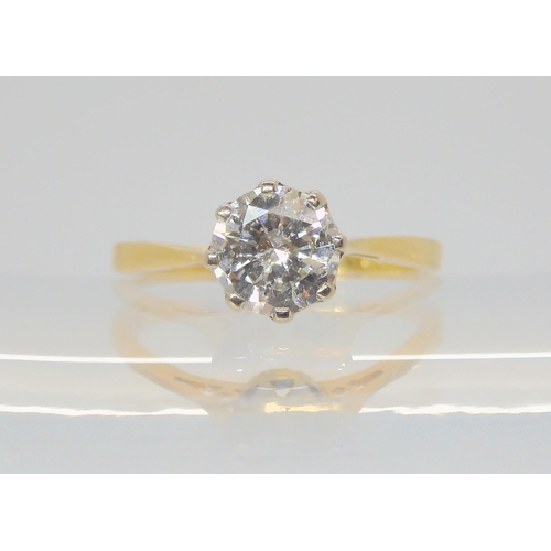 2809 - A SOLITAIRE DIAMOND RINGthe 18ct yellow and white gold classic crown mount is set with an estimated ... 