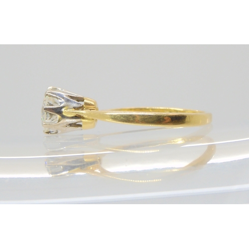 2809 - A SOLITAIRE DIAMOND RINGthe 18ct yellow and white gold classic crown mount is set with an estimated ... 