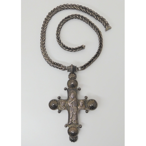 2810 - A LARGE WHITE METAL RELIQUARY CROSSwith hand chased detail to the figures and a handmade loop in loo... 