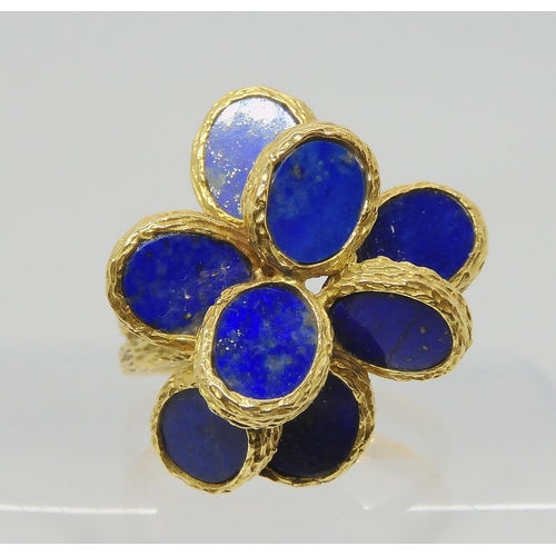 2817 - A RETRO LAPIS LAZULI RINGthe bark textures ring has flat planes of lapis lazuli set win a flower for... 