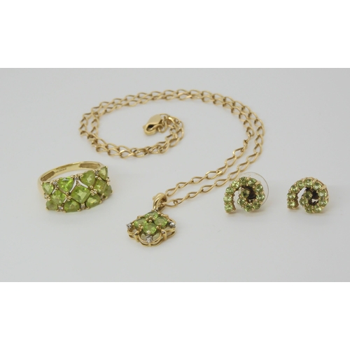 2824 - A COLLECTION OF PERIDOT JEWELScomprising of a 9ct gold flower pendant mounted with four peridots wit... 