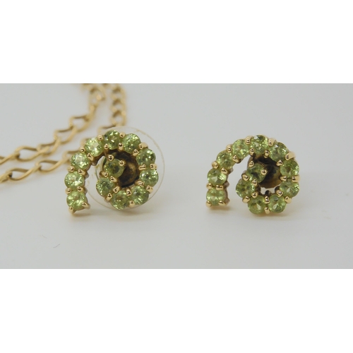 2824 - A COLLECTION OF PERIDOT JEWELScomprising of a 9ct gold flower pendant mounted with four peridots wit... 