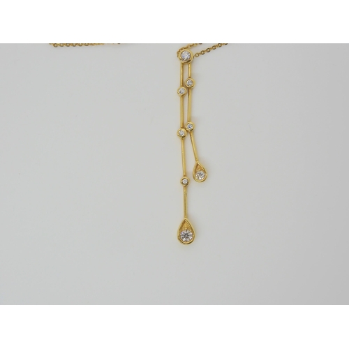 2825 - AN 18CT GOLD RAINDROP PENDANTset with estimated approx 0.20cts of brilliant cut diamonds on a fine 1... 