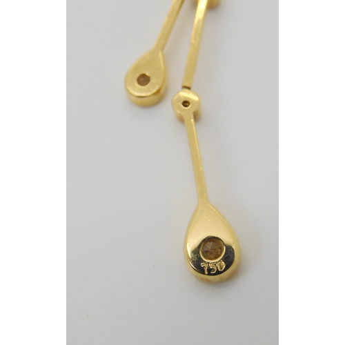 2825 - AN 18CT GOLD RAINDROP PENDANTset with estimated approx 0.20cts of brilliant cut diamonds on a fine 1... 