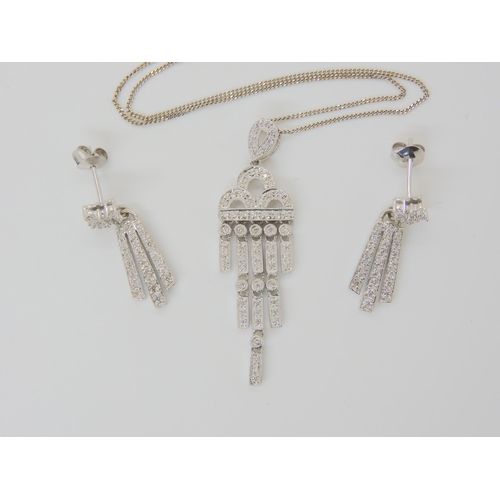 2831 - DIAMOND PENDANT AND EARRINGSthe pendant of Art Deco form is set throughout with brilliant cut diamon... 