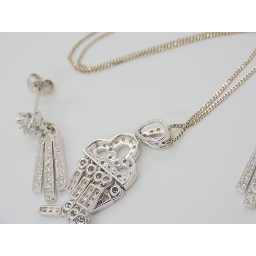 2831 - DIAMOND PENDANT AND EARRINGSthe pendant of Art Deco form is set throughout with brilliant cut diamon... 