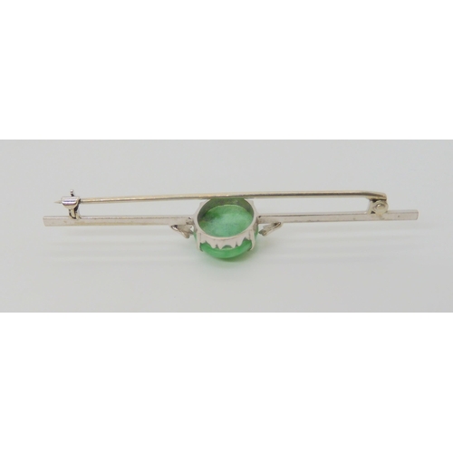 2832 - A CHINESE GREEN HARDSTONE BROOCHthe green hardstone measures approx 15.7mm x 11mm x 4.5mm, length 6.... 