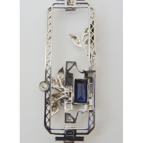 2835 - AN ART DECO DIAMOND & SAPPHIRE PENDANTset throughout in 18ct white gold and platinum with floral... 