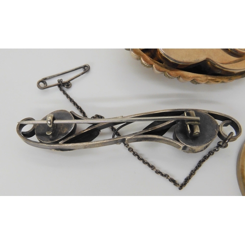 2838 - THREE SILVER JEWELSa French silver gold plated wind up kinetic brooch set with gems, dimensions 4.5c... 