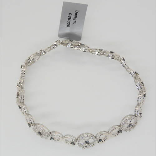 2839 - A SILVER BLUE AND WHITE DIAMOND BRACELETlength 18cm, weight 9gms