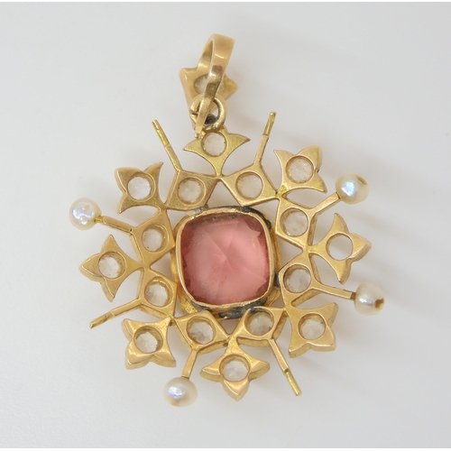 2841 - TWO VINTAGE PENDANTSa yellow metal turquoise and pearl flower, diameter 2.5cm, together with a pink ... 