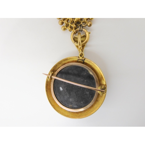 2842 - A VICTORIAN AGATE PENDANTcraftsman made in yellow metal mounted with a banded agate, with blue and w... 