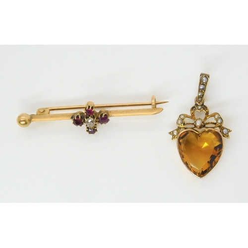 2847 - TWO VINTAGE JEWELSa yellow metal mounted citrine heart pendant, further set with pearls to the bow m... 