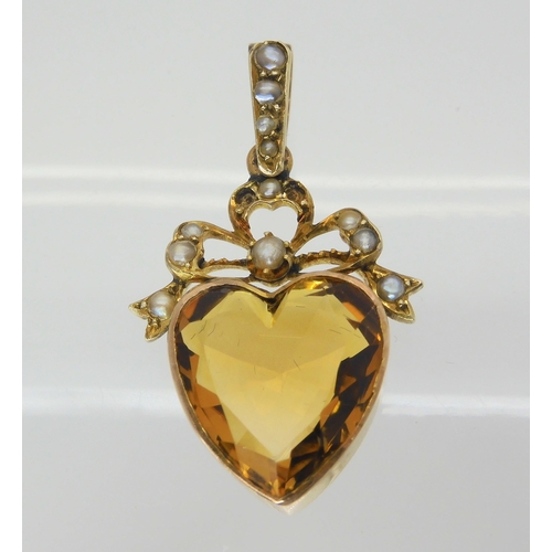 2847 - TWO VINTAGE JEWELSa yellow metal mounted citrine heart pendant, further set with pearls to the bow m... 