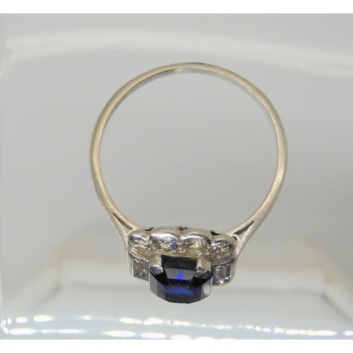 2848 - A SAPPHIRE & DIAMOND RINGset throughout in platinum, with a step cut sapphire of approximate dim... 