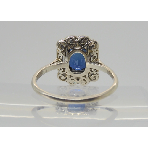 2848 - A SAPPHIRE & DIAMOND RINGset throughout in platinum, with a step cut sapphire of approximate dim... 