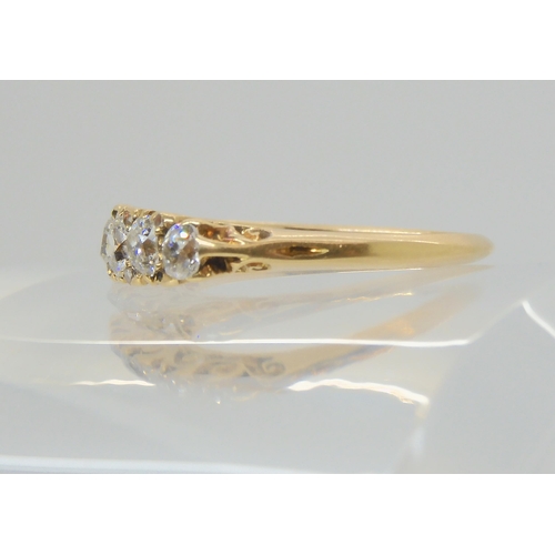 2850 - AN 18CT GOLD FIVE STONE DIAMOND RINGin classic scroll mount (one diamond missing) set with 0.60cts o... 