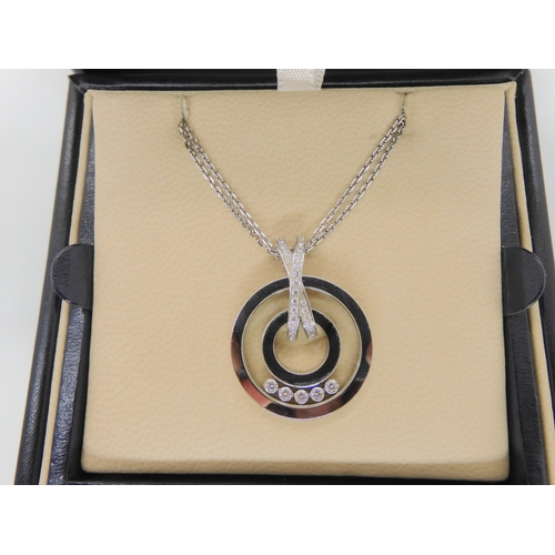 2854 - A CHOPARD HAPPY DIAMONDS PENDANT18k white gold round pendant and chain signed Chopard, 750, happy di... 