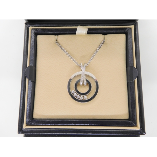 2854 - A CHOPARD HAPPY DIAMONDS PENDANT18k white gold round pendant and chain signed Chopard, 750, happy di... 