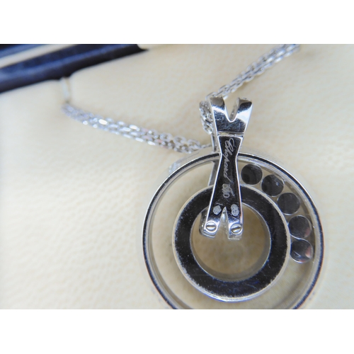 2854 - A CHOPARD HAPPY DIAMONDS PENDANT18k white gold round pendant and chain signed Chopard, 750, happy di... 