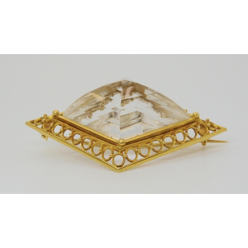 2856 - A LARGE ROCK CRYSTAL BROOCHmounted in yellow metal, the lozenge shaped crystal is well cut and the m... 