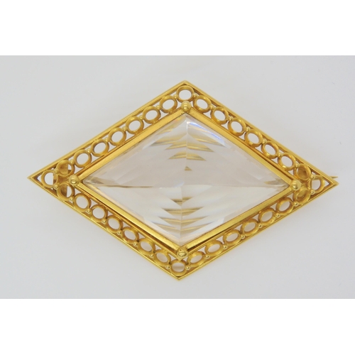 2856 - A LARGE ROCK CRYSTAL BROOCHmounted in yellow metal, the lozenge shaped crystal is well cut and the m... 