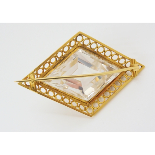 2856 - A LARGE ROCK CRYSTAL BROOCHmounted in yellow metal, the lozenge shaped crystal is well cut and the m... 