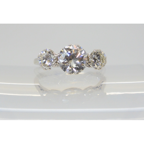 2861 - A SUBSTANTIAL DIAMOND THREE STONE RINGmounted throughout in platinum, with a really pretty setting. ... 