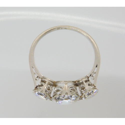 2861 - A SUBSTANTIAL DIAMOND THREE STONE RINGmounted throughout in platinum, with a really pretty setting. ... 