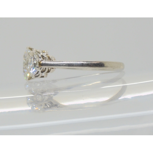 2861 - A SUBSTANTIAL DIAMOND THREE STONE RINGmounted throughout in platinum, with a really pretty setting. ... 