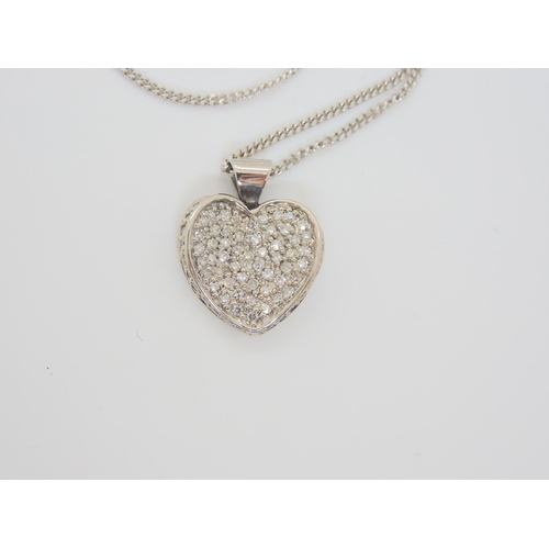 2862 - A 9CT GOLD DIAMOND HEART PENDANTset with estimated approx 0.40cts of pave set diamonds,dimensions 1.... 