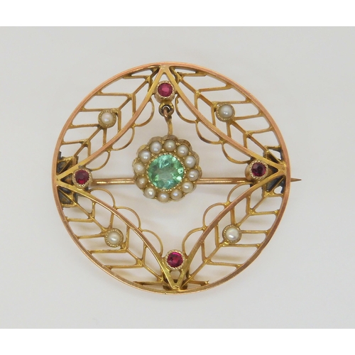 2868 - A 9CT MULTI GEM SET VINTAGE BROOCHthe central gem is an emerald, surrounded with split pearls and re... 