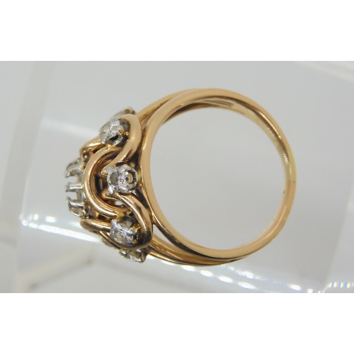 2873 - A HANDMADE KNOT PATTERN RINGmade in rose coloured metal, set with estimated approx 0.60cts of brilli... 