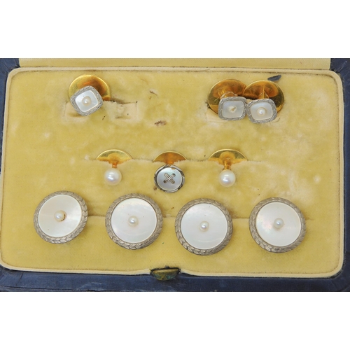 2876 - A BOXED SET OF BUTTONS & STUDSFour 18ct gold and white metal mother of pearl and pearl set butto... 