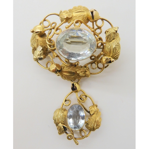 2879 - AN ARTS & CRAFTS PENDANT BROOCHmounted in yellow metal, and set with two aquamarines, largest ap... 