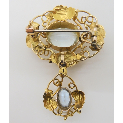 2879 - AN ARTS & CRAFTS PENDANT BROOCHmounted in yellow metal, and set with two aquamarines, largest ap... 