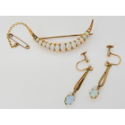 2880 - AN OPAL CRESCENT BROOCH & EARRINGSthe brooch set with oval cabochon opals, largest approx 6mm x ... 