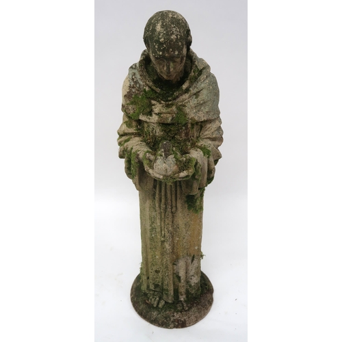 2068 - A 20TH CENTURY STONEWARE STATUE OF ST. FRANCISwith the robed figure clutching a dove, 91cm high... 